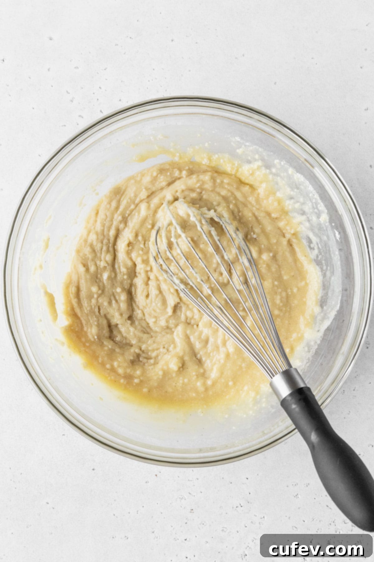 Guilt-Free Cupcakes 6 Dry ingredients and wet ingredients combined for making dairy-free cupcakes, showing a thick, lumpy batter before the final addition of dairy-free milk.