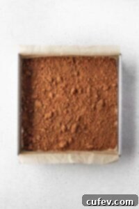 Cinnamon sugar filling added on top of first layer of batter, forming a distinct middle layer.