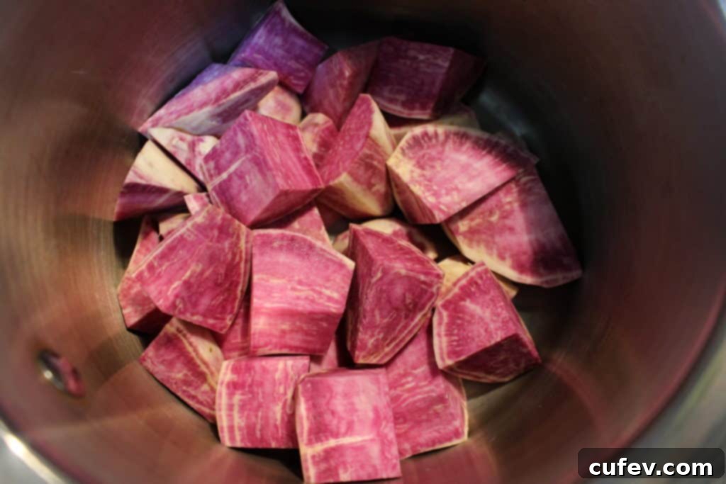 Peeled and chopped Japanese purple sweet potatoes, ready for boiling to create the Halloween eyeball filling