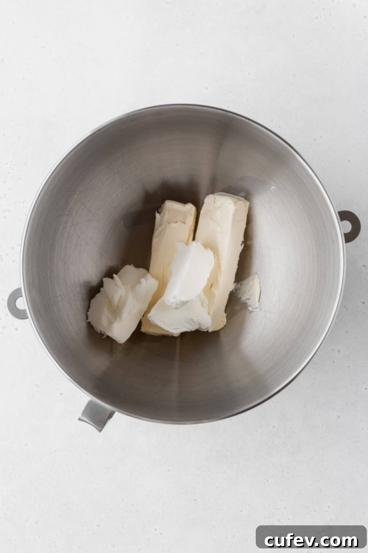 Adding the butter and shortening to the mixer bowl for lemon buttercream.