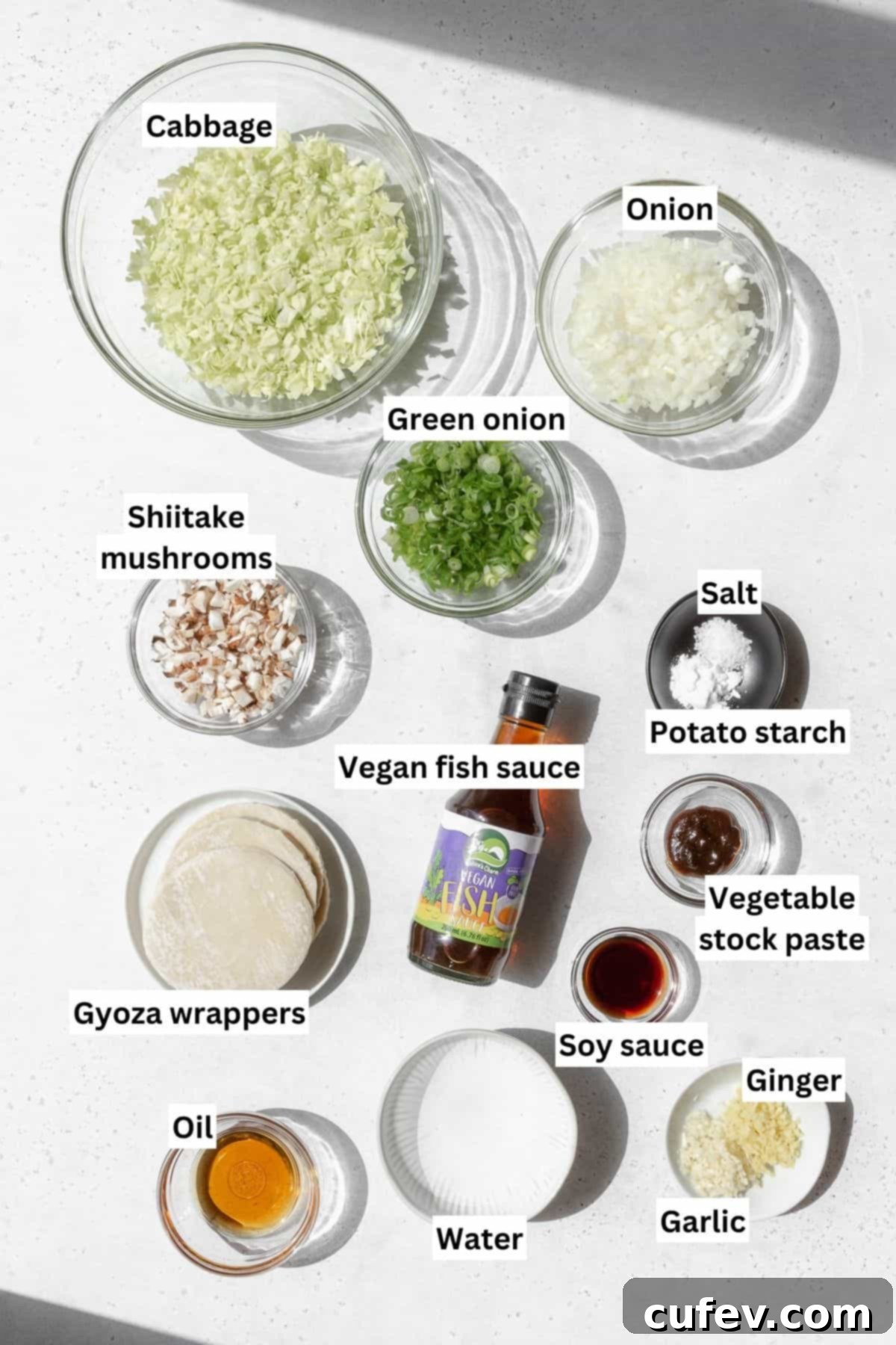 Overhead shot of vegan gyoza ingredients measured out into bowls.