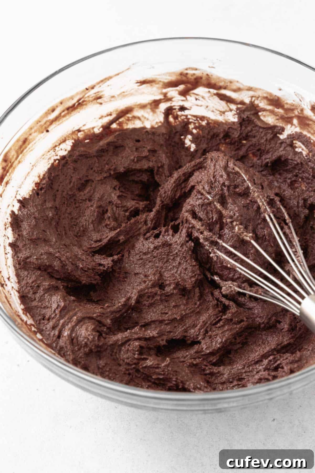 The dark, rich chocolate sandwich cookie batter resting peacefully in a glass mixing bowl, developing its perfect texture.