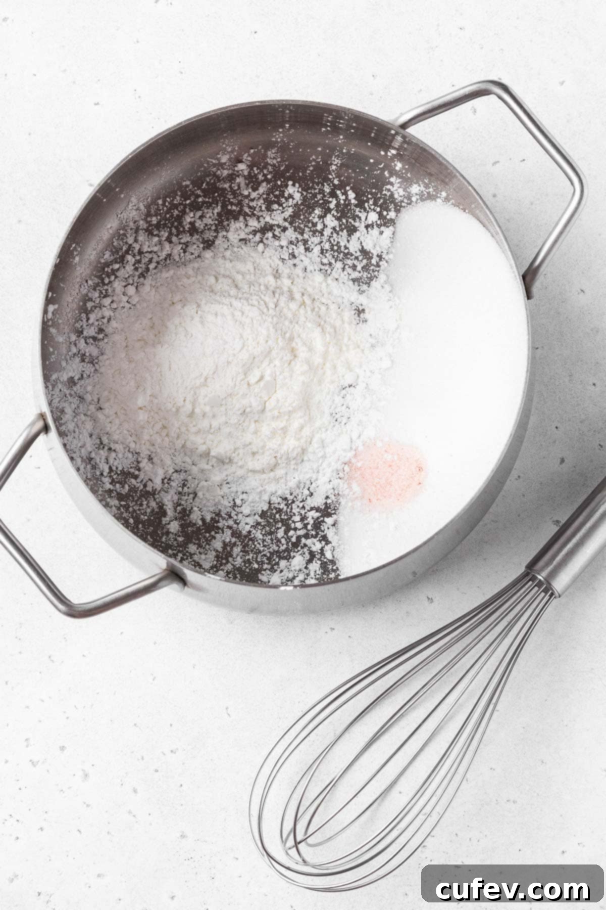 Dry ingredients for making vegan coconut pie filling in a saucepan.