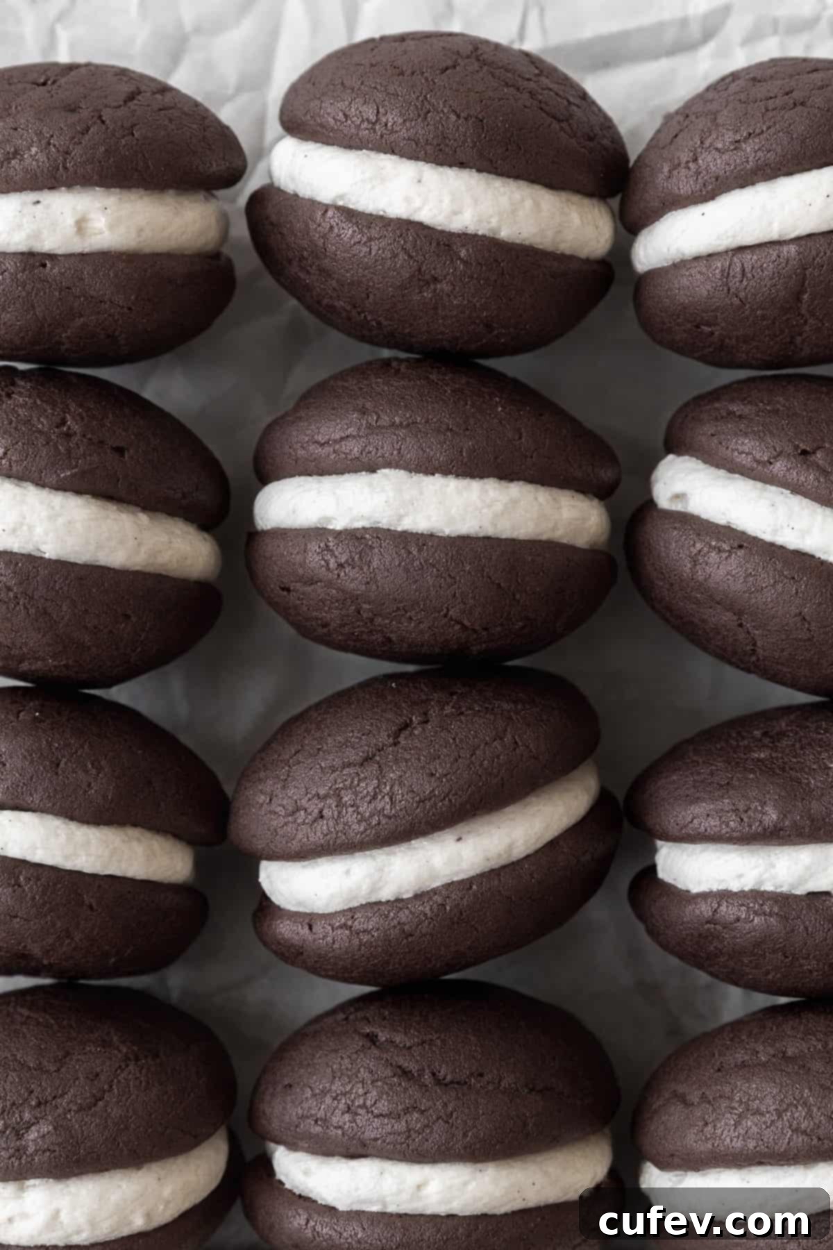 Gluten Free Whoopie Pies 11 Gluten-free whoopie pies on a white parchment paper.