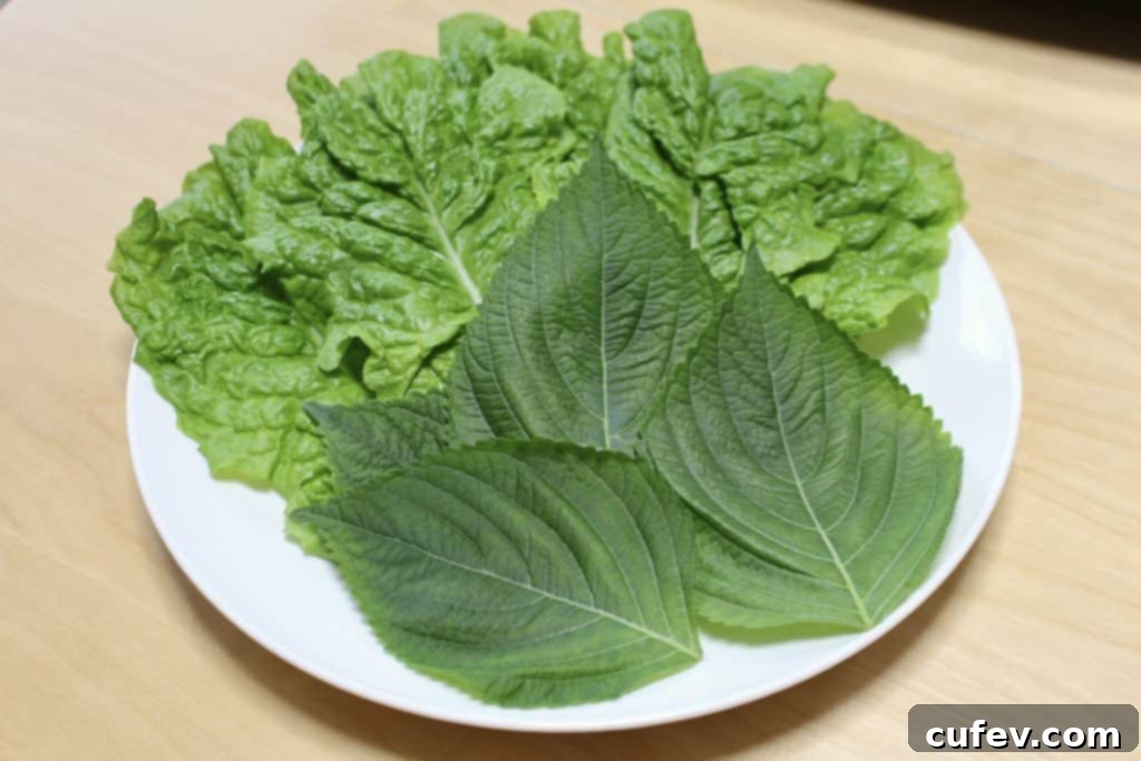 Whole30 Samgyeopsal with fresh greens and pork belly slices ready for grilling