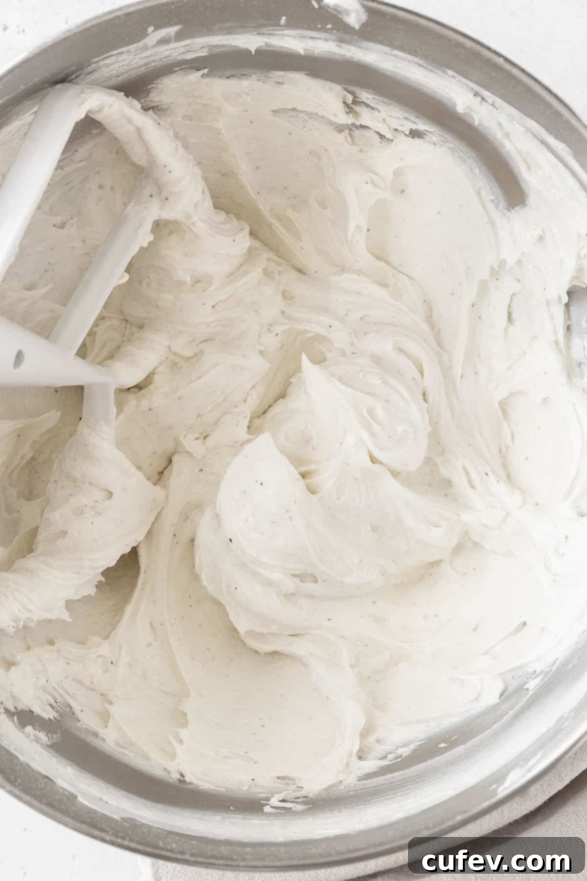 An overhead shot of a mixing bowl of the dairy free buttercream.