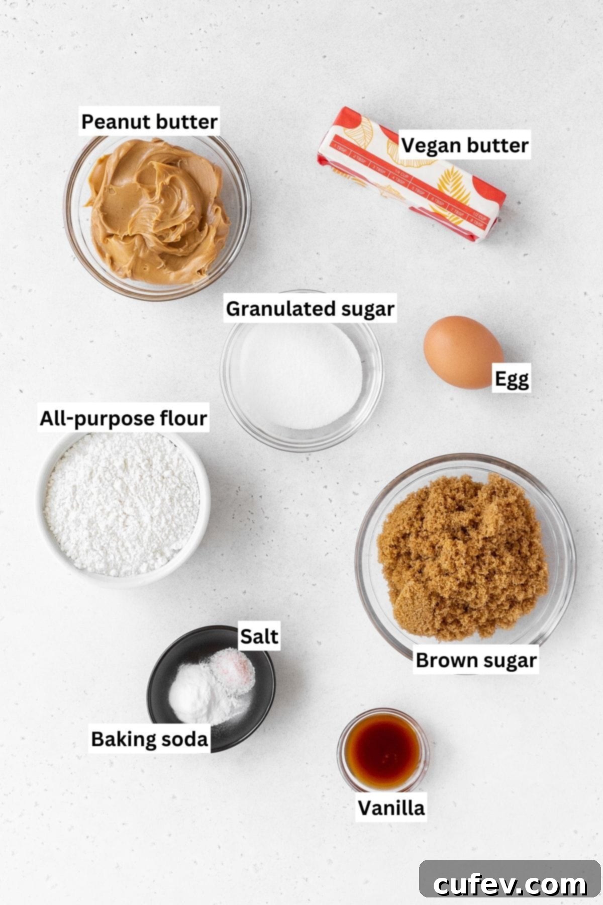 All of the essential ingredients for dairy-free peanut butter cookies, neatly arranged and ready for baking.