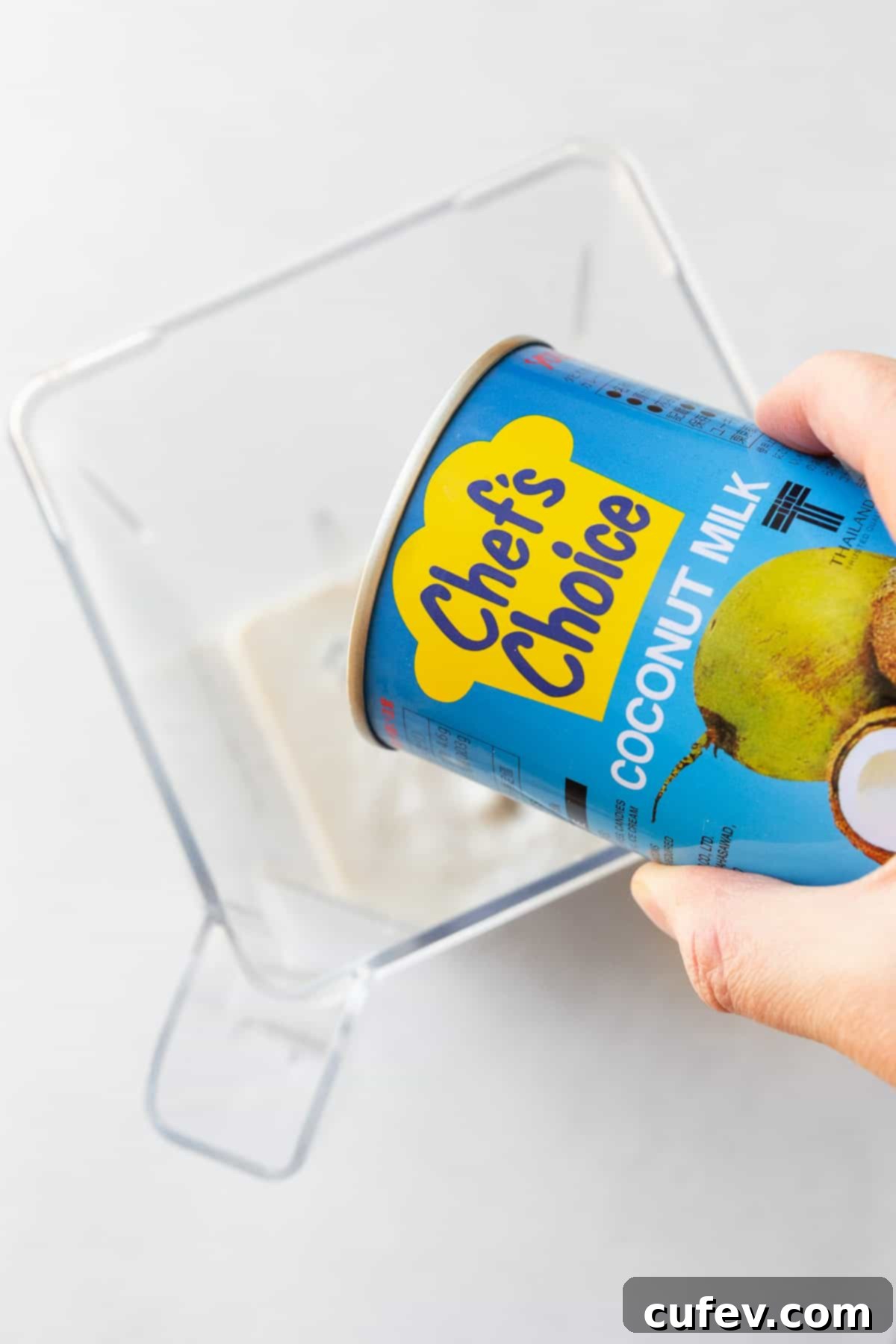 Tropical Mango Bubble Tea 8 Adding Chef's Choice coconut milk into a blender for the mango puree.