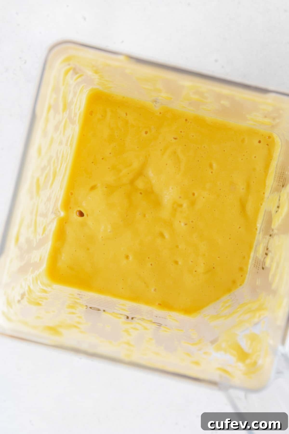 Tropical Mango Bubble Tea 10 Perfectly blended, smooth mango puree in a blender, ready for assembly.