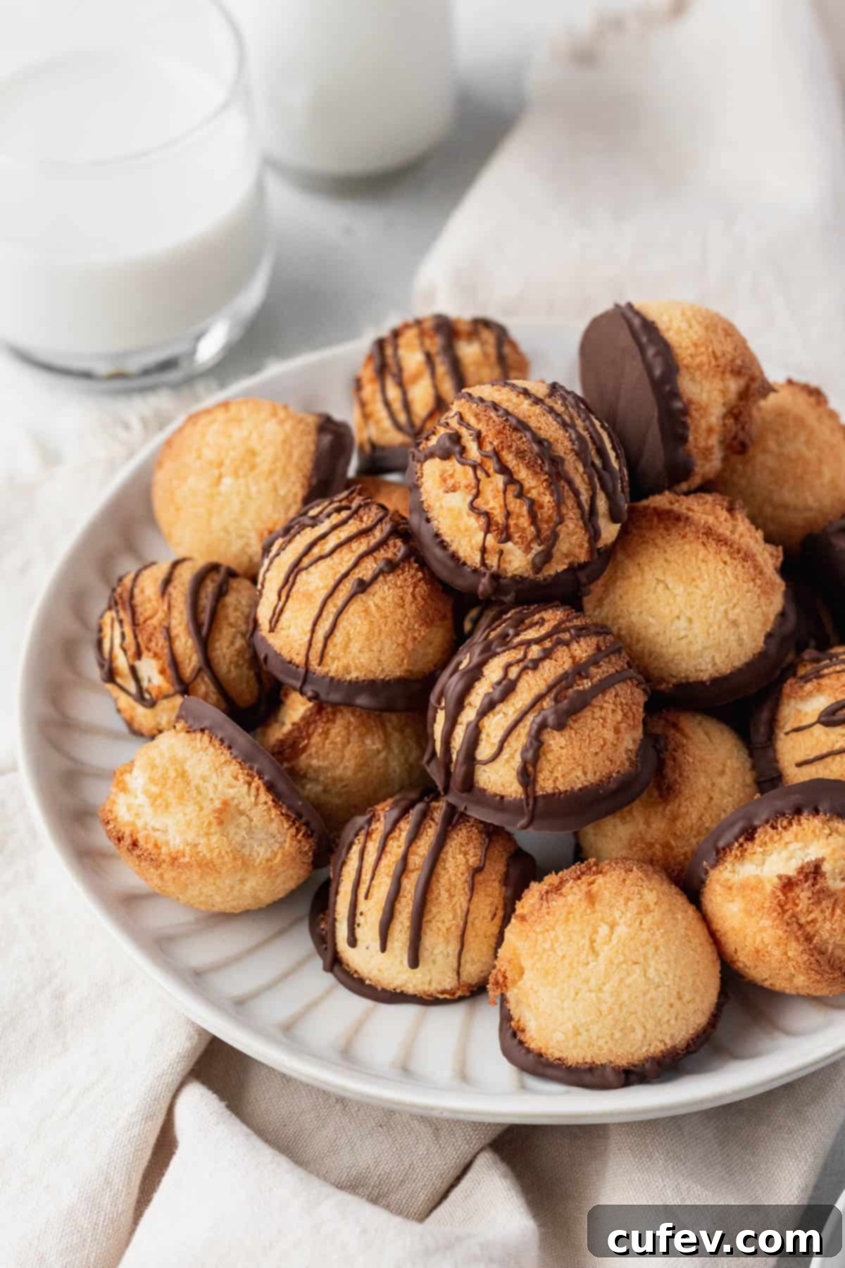 A white plate of the dairy-free macaroons on top of a napkin.