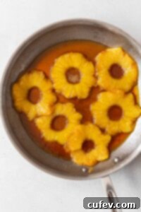 Tropical Gluten-Free Pineapple Upside Down Dream 6 The pineapple and brown sugar mixture in a skillet.