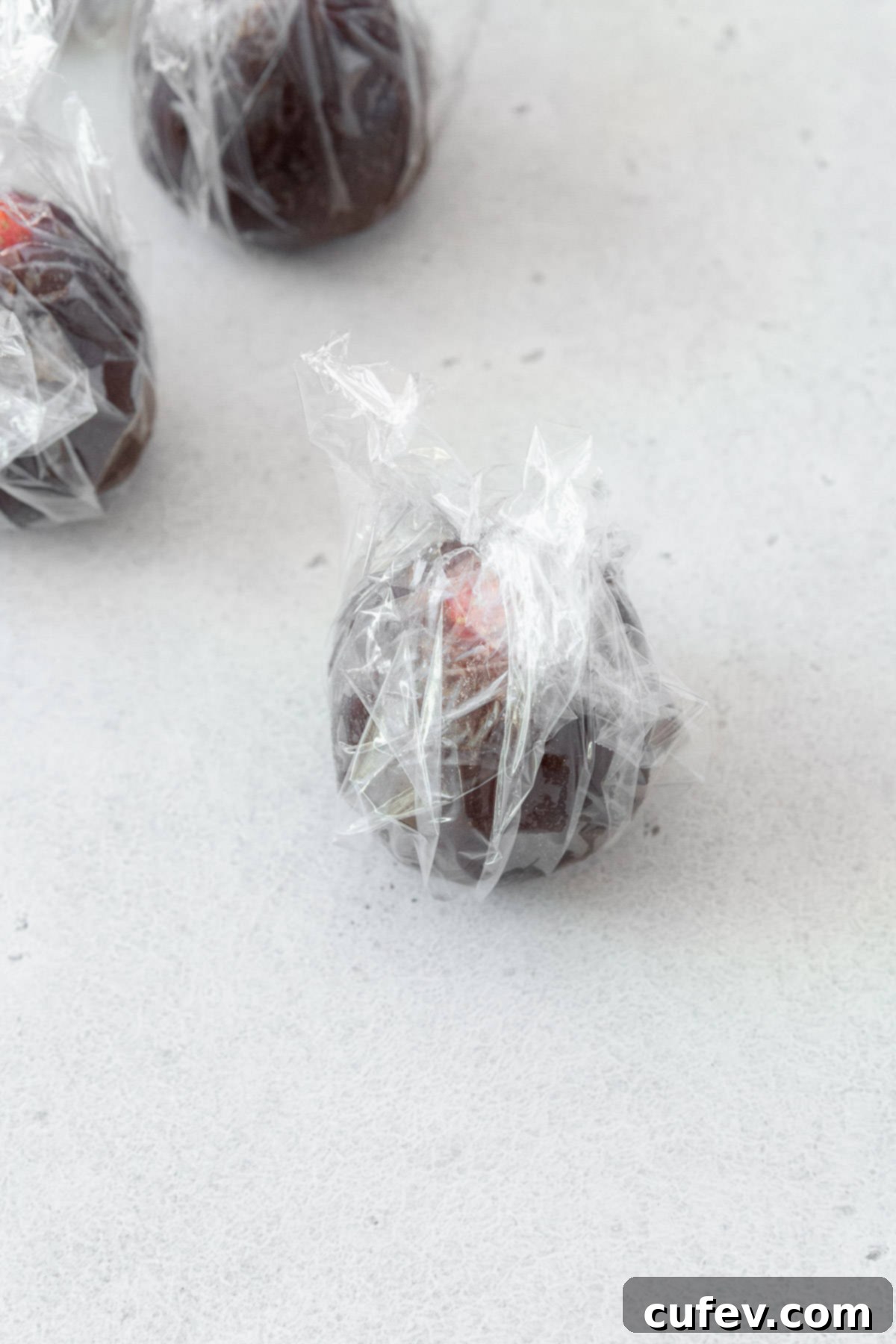 Fresh Japanese Strawberry Mochi 7 Anko wrapped strawberry wrapped in plastic wrap to prevent it from drying.