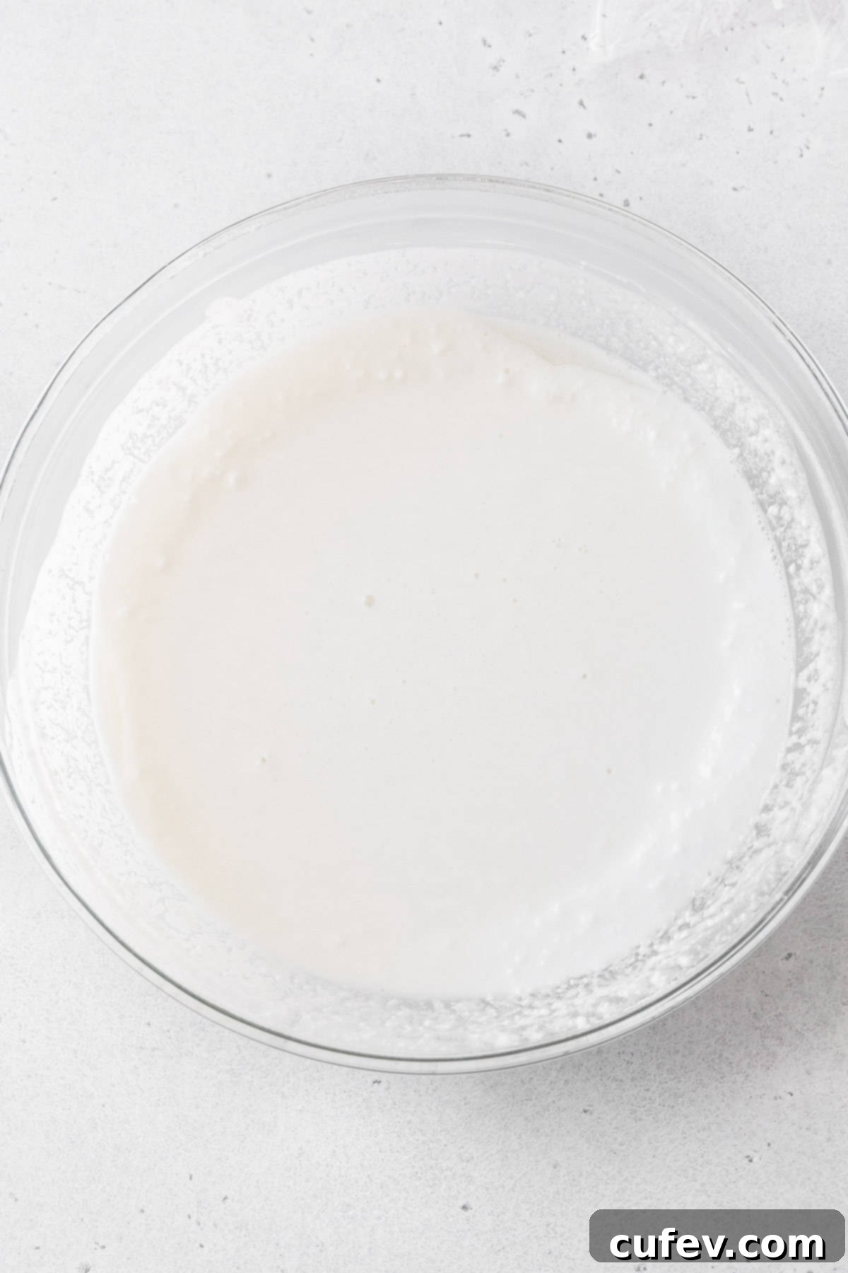 Fresh Japanese Strawberry Mochi 9 Daifuku batter in a glass bowl after being microwaved for a minute.