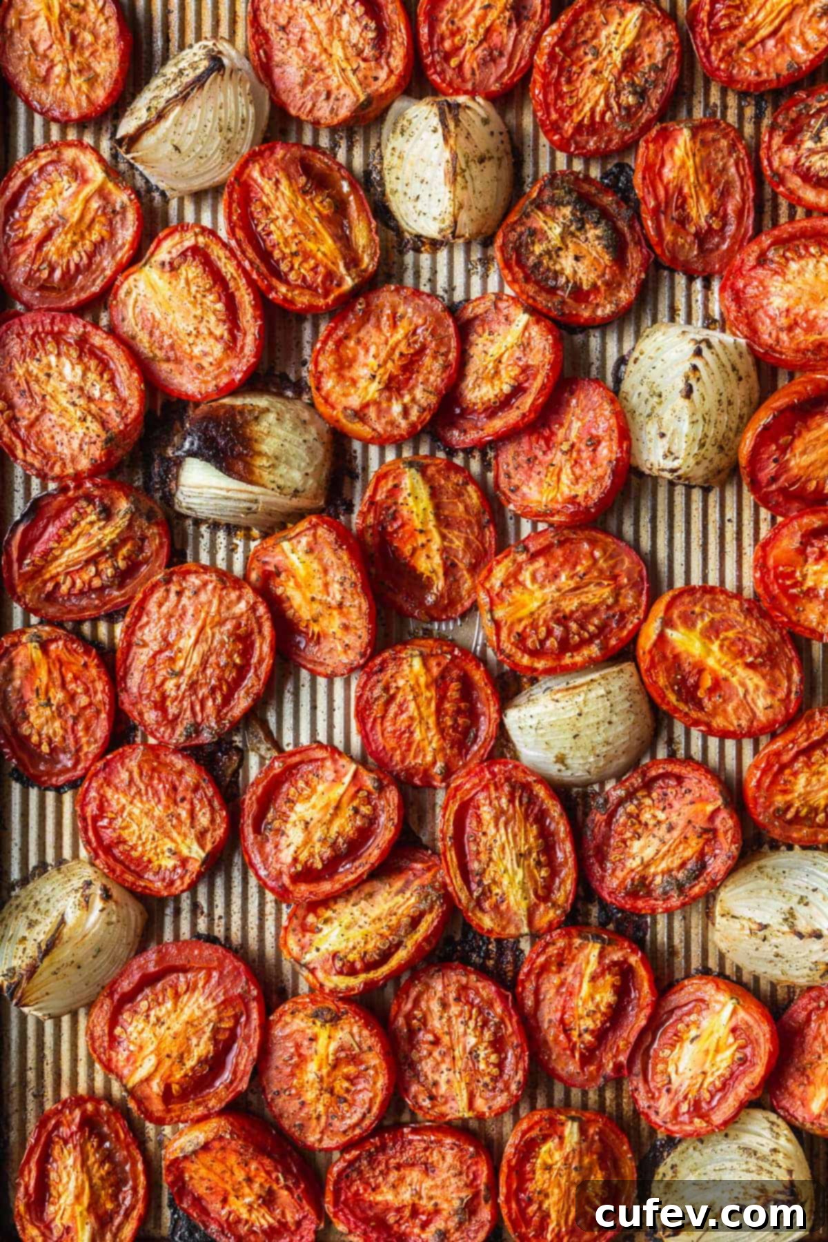 A tray of roasted tomatoes and onions.