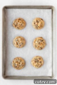 Baked kitchen sink cookies on a baking sheet.