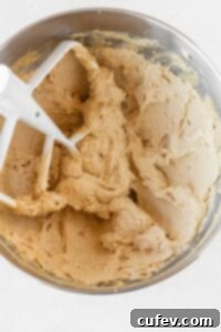 Butter and sugar creamed together in the bowl of a stand mixer.