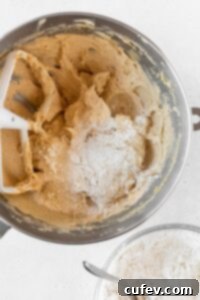 Dry ingredients added to the bowl to make cookie dough.