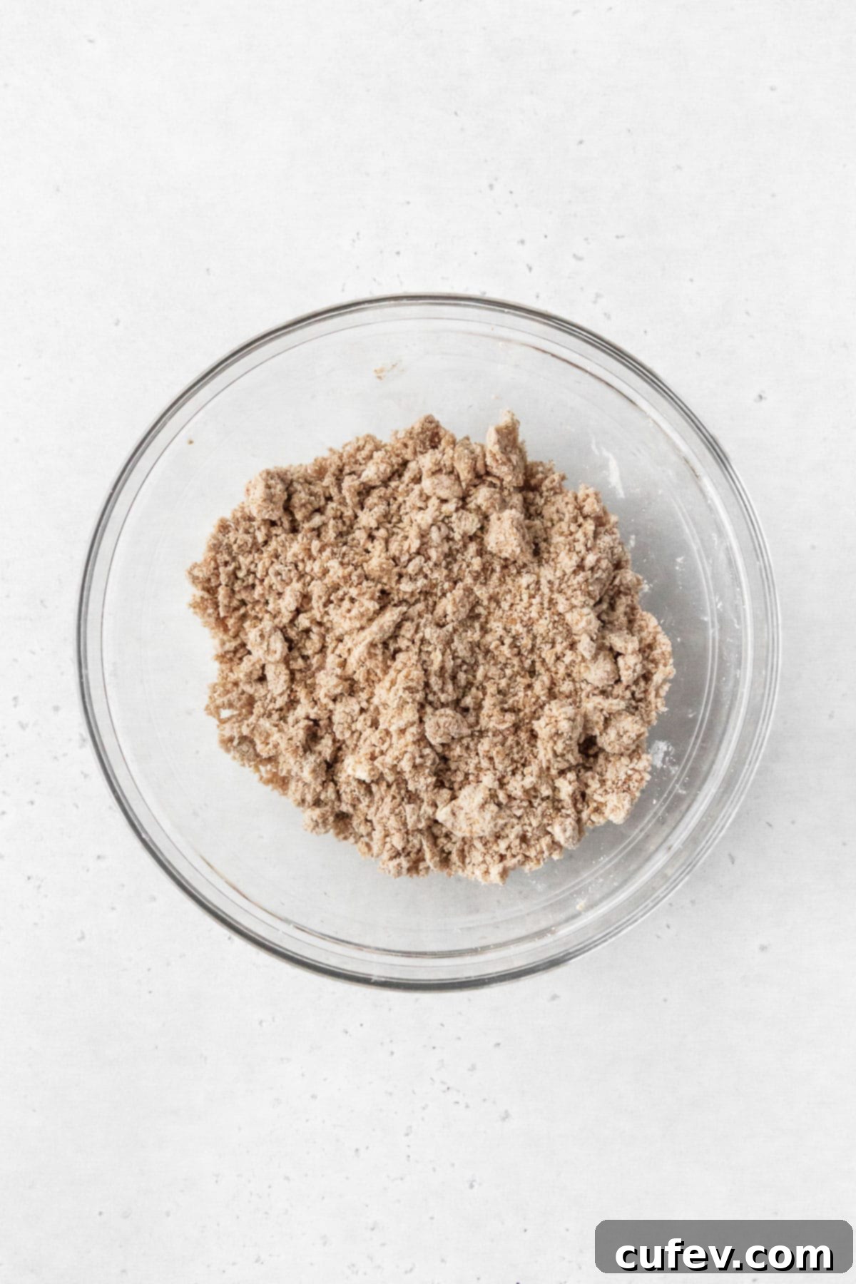 Crumb topping after mixing together into large crumbles.