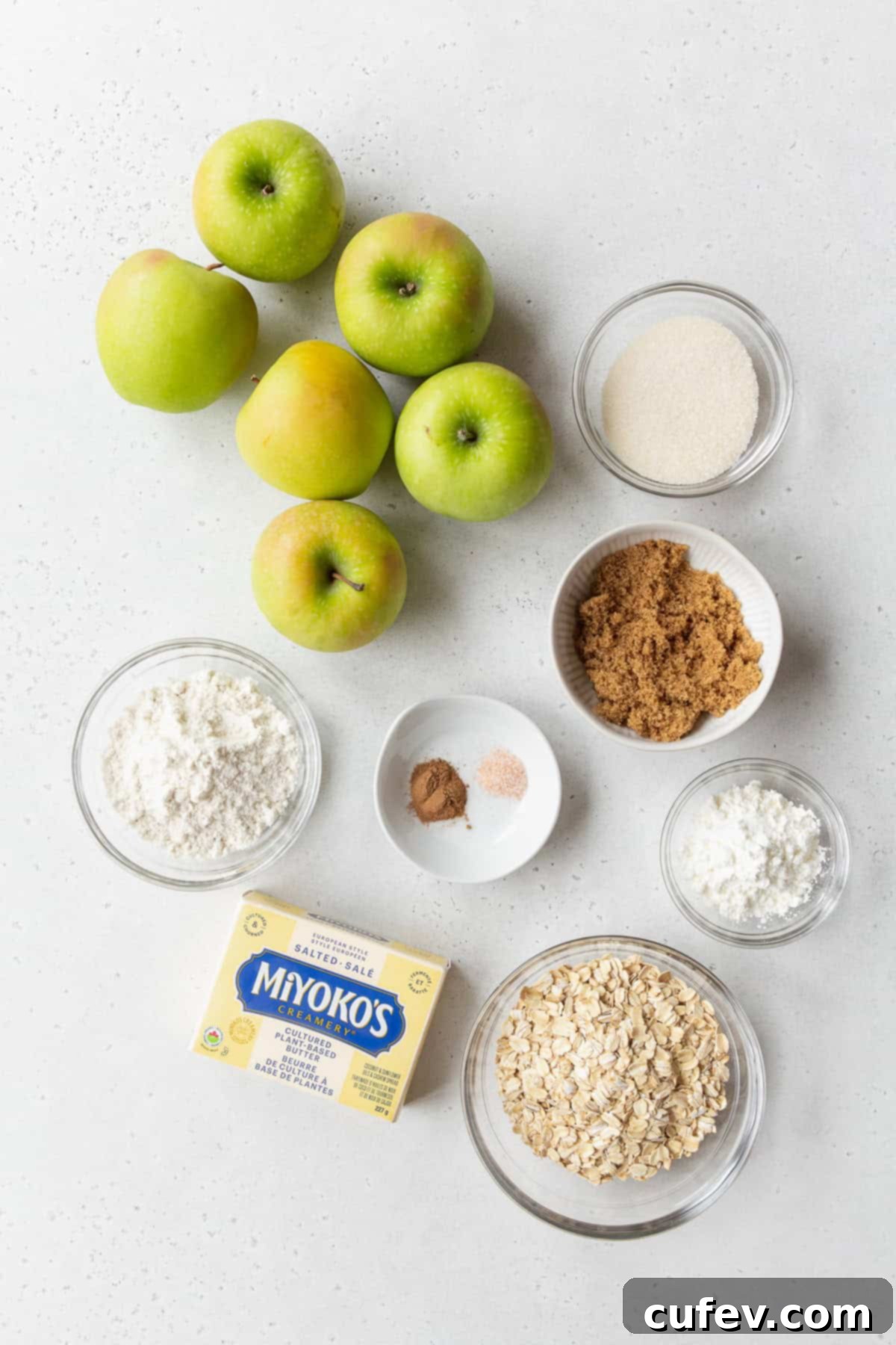 Comforting Gluten-Free Apple Crumble 3 Ingredients to make gluten-free apple crisp on a light grey surface