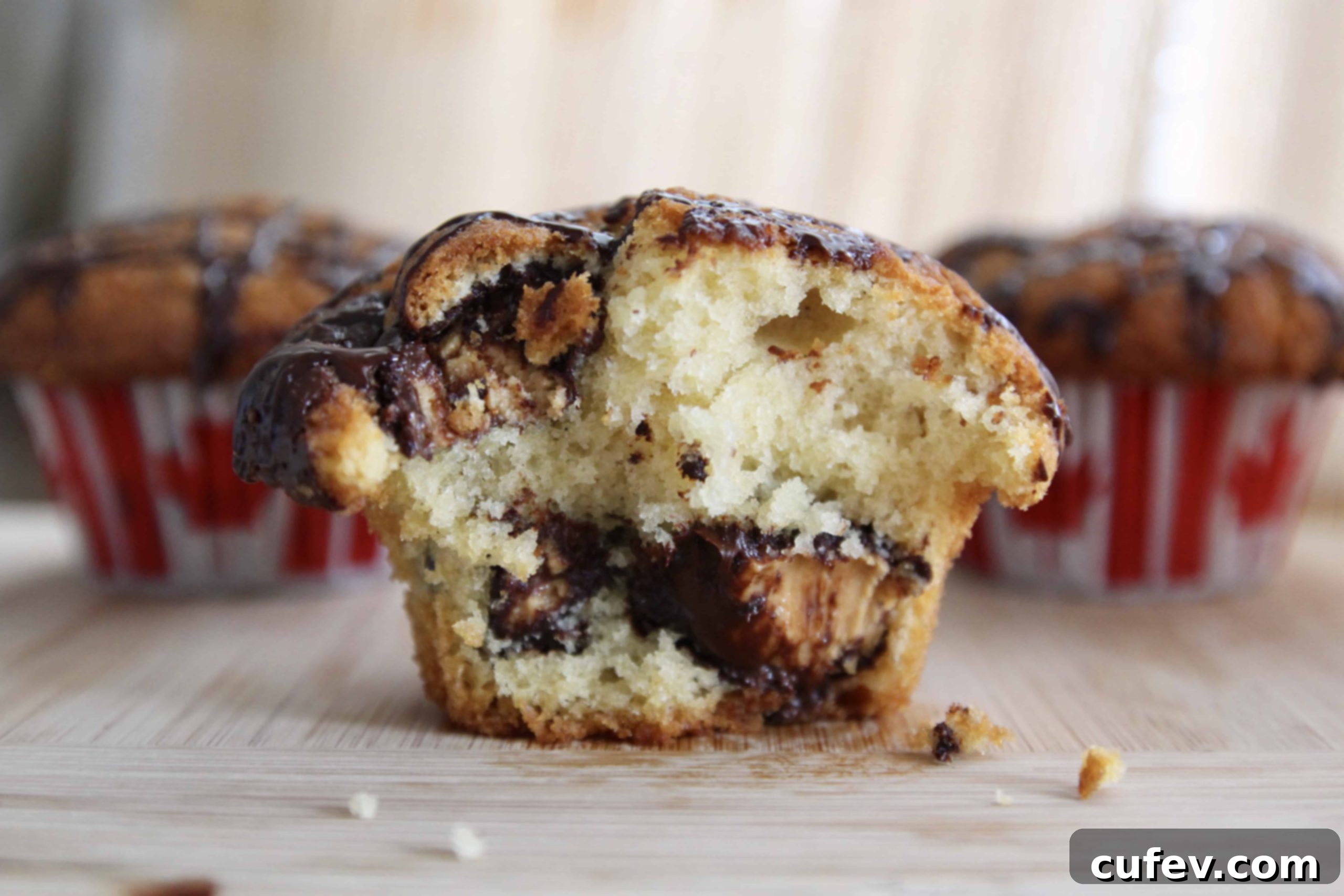 Delicious Moose Tracks Muffins with Peanut Butter Cups and Chocolate Drizzle