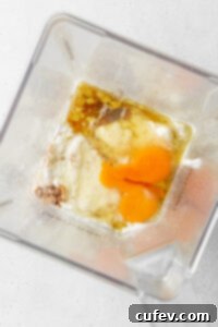 Ingredients for pancakes in a blender.