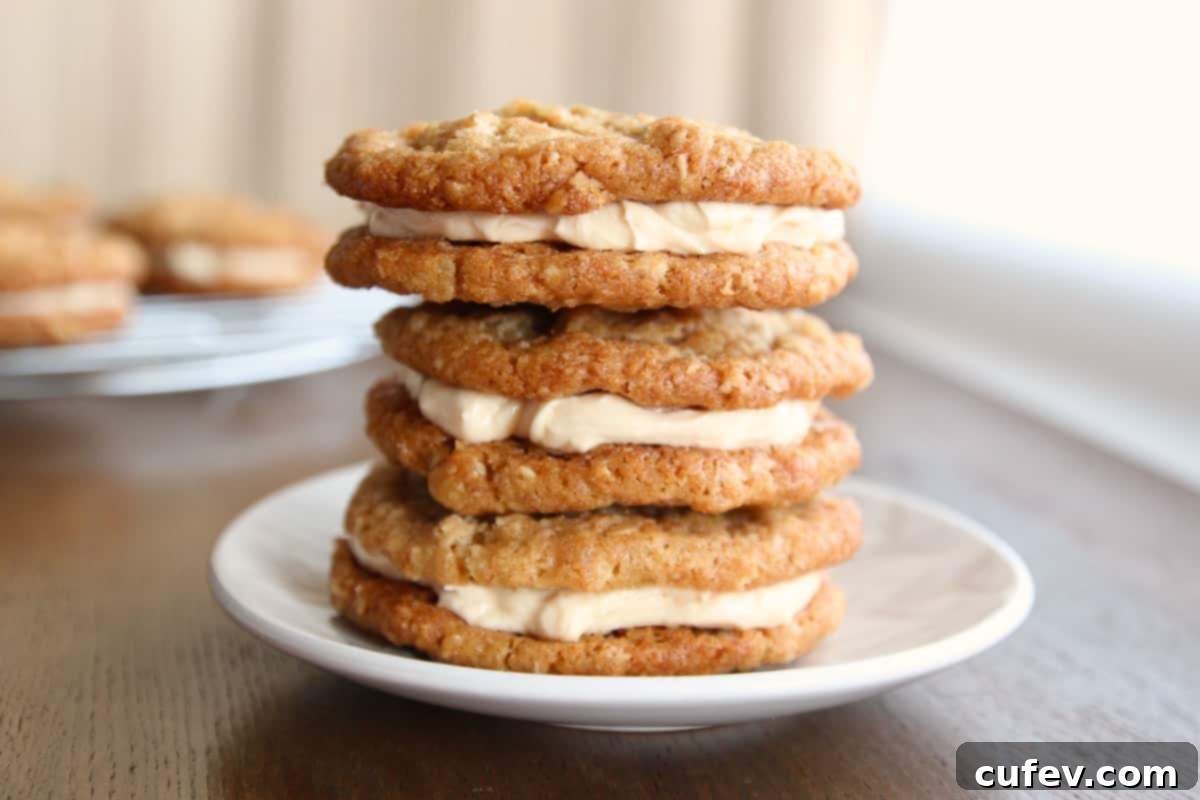 A stack of oatmeal cream pie cookies on a small dessert plate.