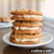 A stack of 3 oatmeal cream pies on a dessert plate.