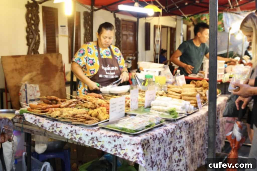 Street vendors setting up stalls in preparation for the bustling Friday night market in Fisherman's Village
