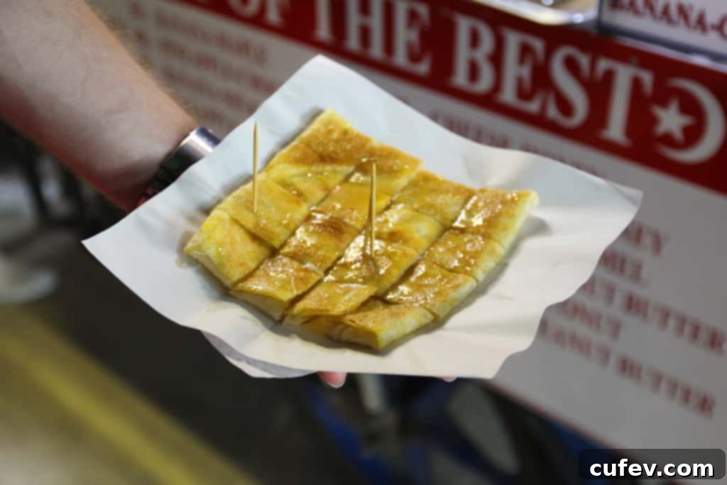Close-up of a cheese and honey grilled pancake, a delicious street food in Koh Samui