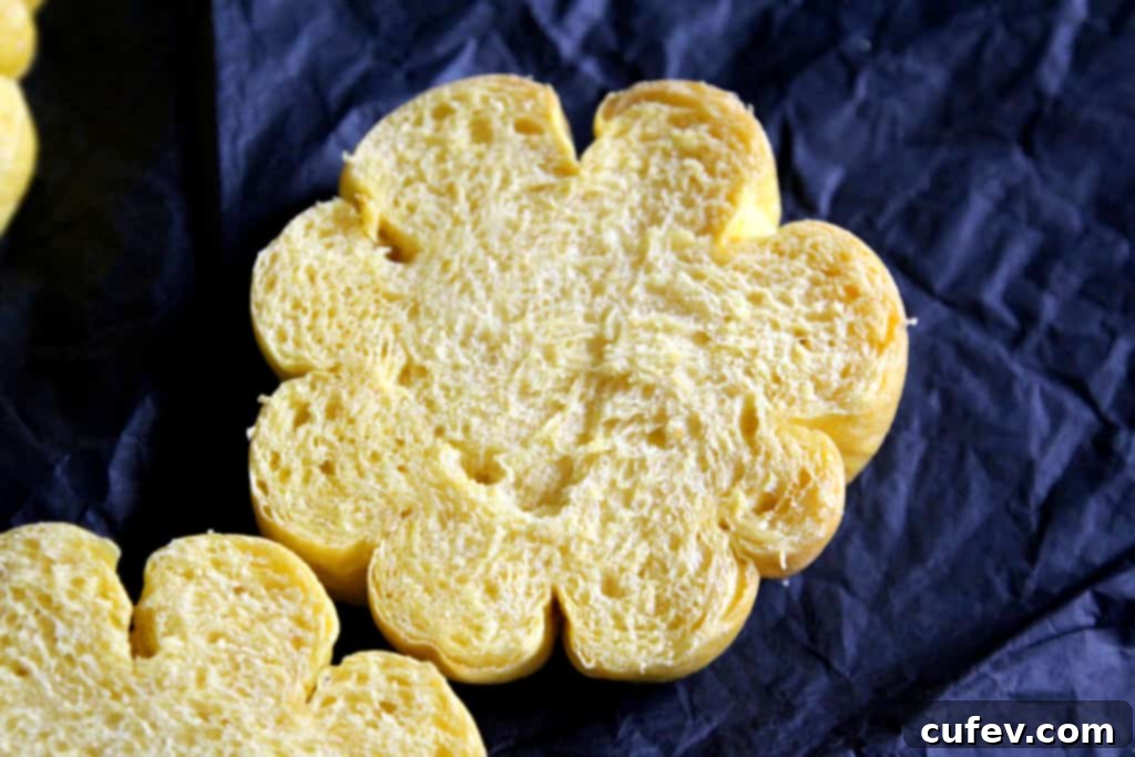 Extremely fluffy and soft interior of a freshly baked homemade pumpkin bun.