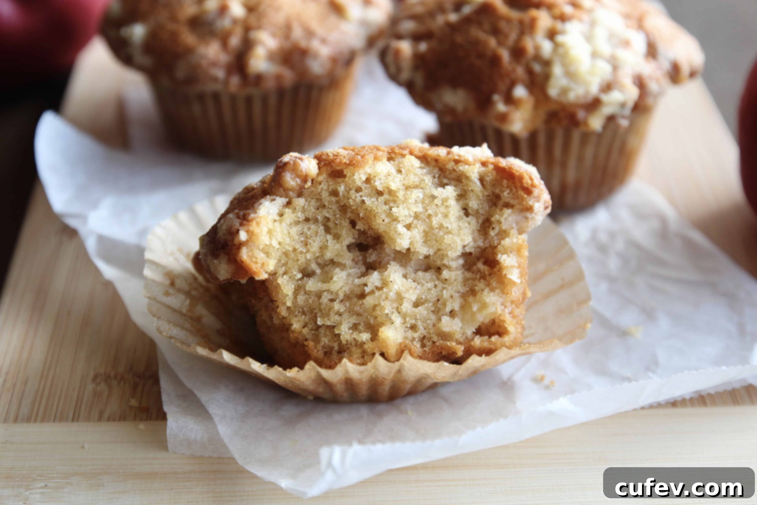 A bitten apple crumble muffin