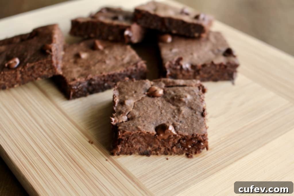 Close-up of moist Peppermint Black Bean Brownies, showing chocolate chips and fudgy texture