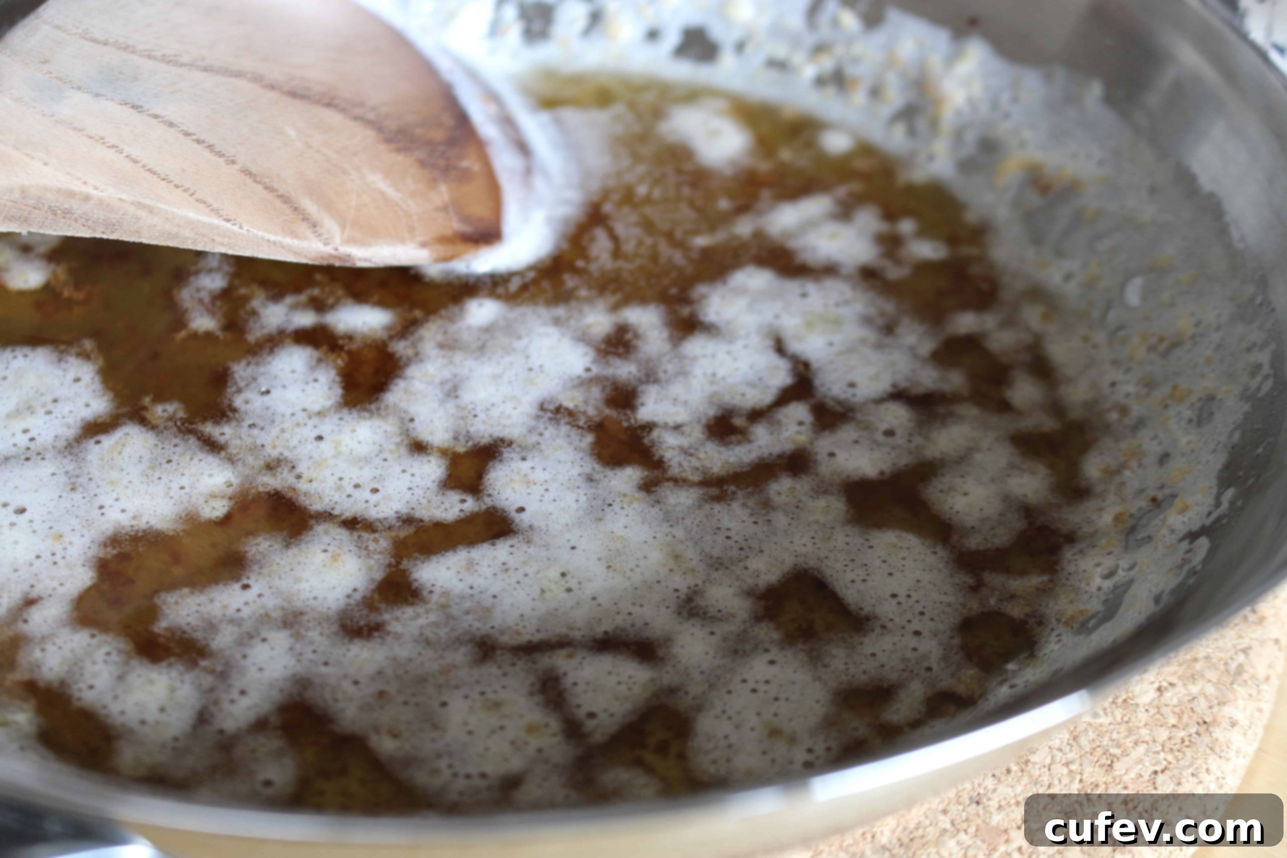 Close-up of baked cheesecake bars in a square pan