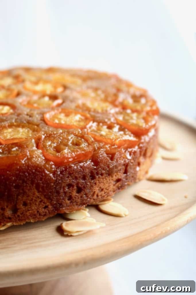 A whole Kumquat Upside Down Cake on a cooling rack