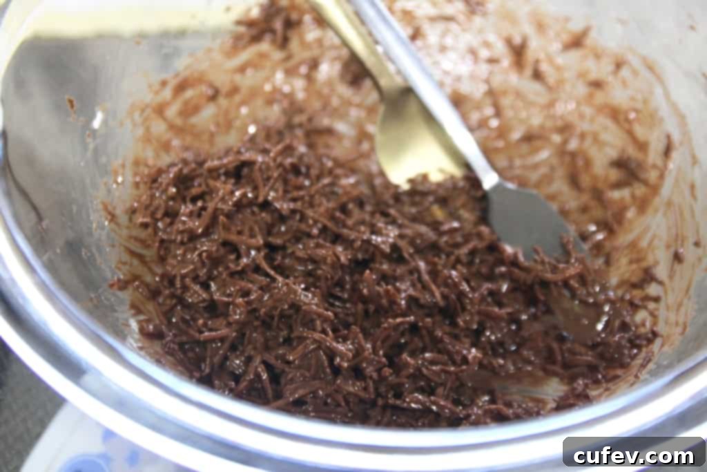 Springtime Gluten-Free Bird's Nest Cookies 4 Mixing unsweetened shredded coconut with melted milk chocolate for the bird's nest cookie topping.