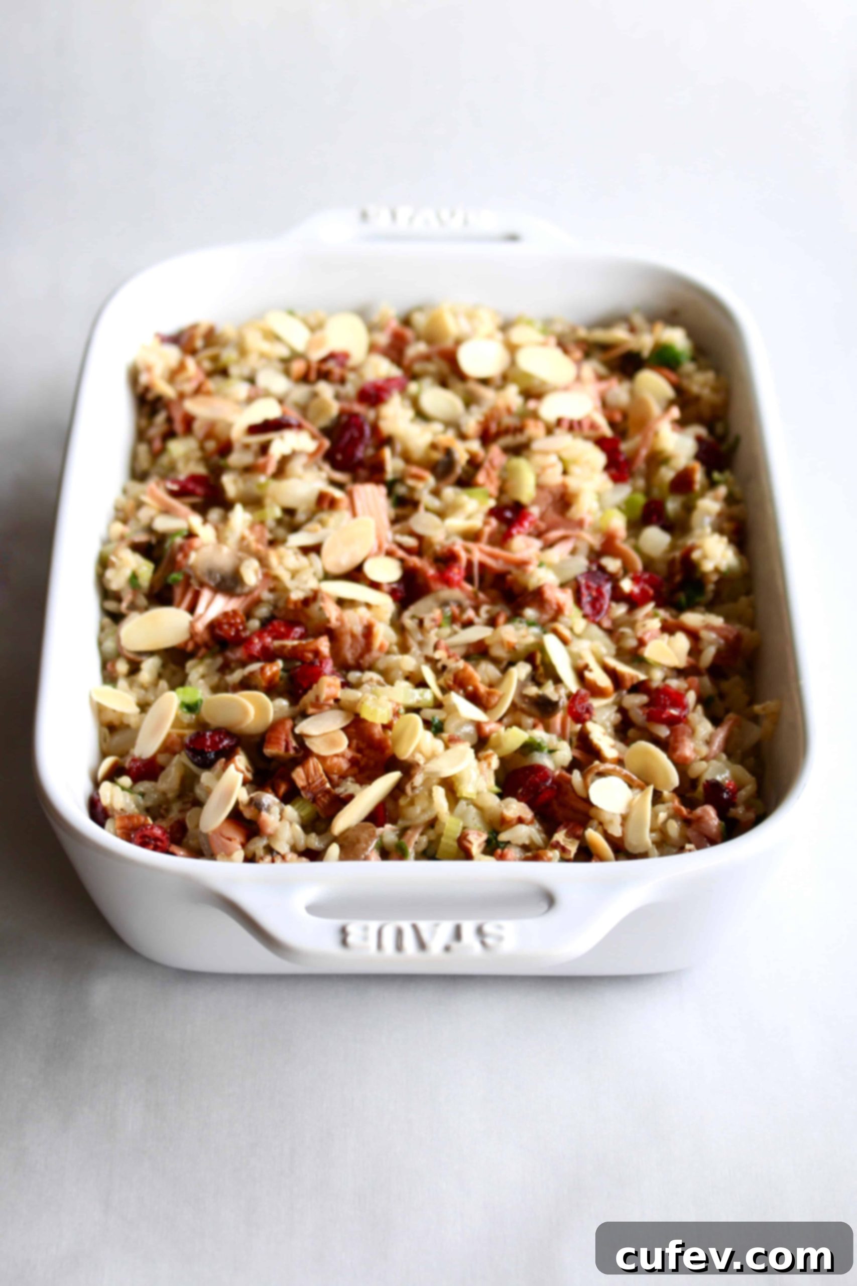 An elegantly served dish of vegan and gluten-free jackfruit rice stuffing, garnished and ready to be enjoyed as a festive holiday side.