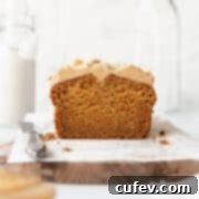 A square image of a delicious sweet potato cake with creamy cashew frosting, ready to be served.