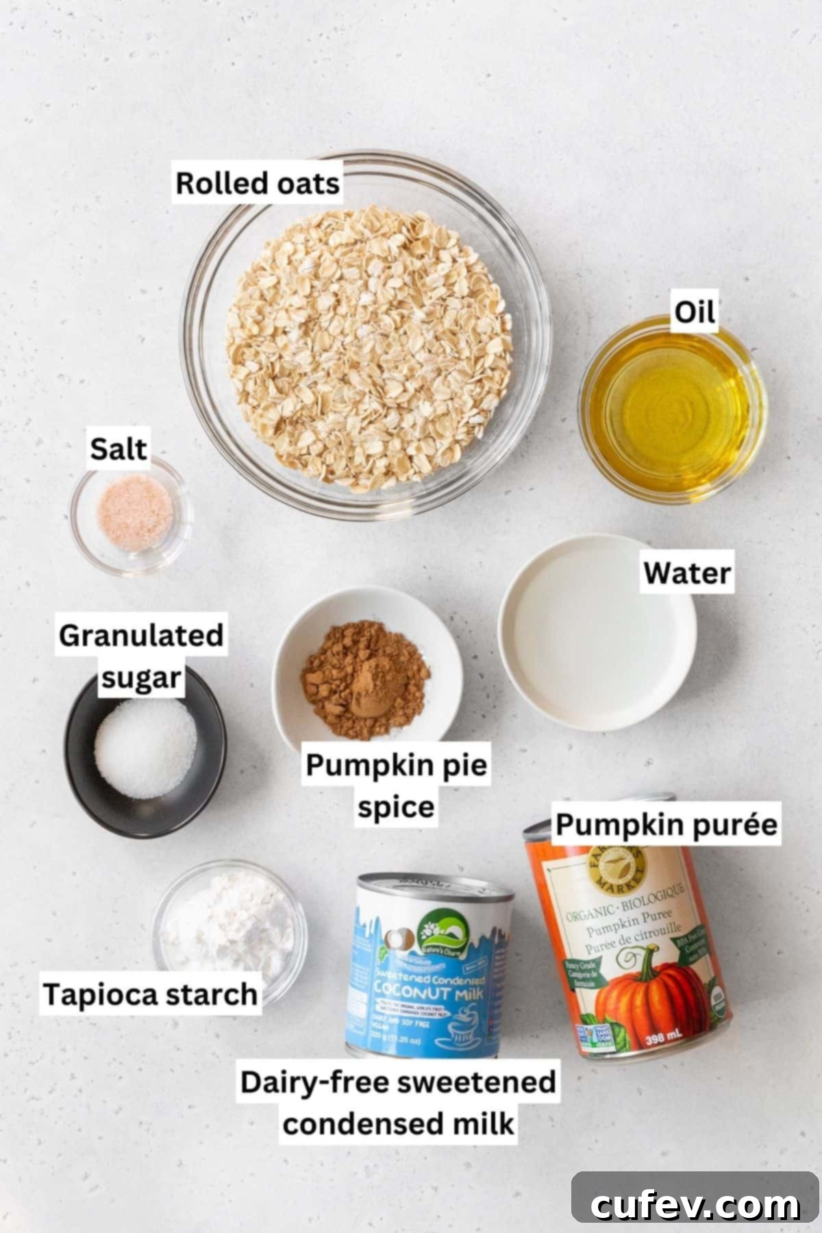 All the vegan pumpkin pie ingredients neatly measured out into individual bowls and arranged for a clear visual.