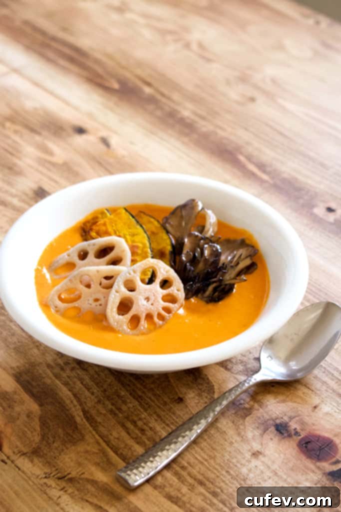 A bowl of steaming vegan coconut curry filled with an assortment of vegetables, showcasing its rich texture and inviting aroma, ready to be served.