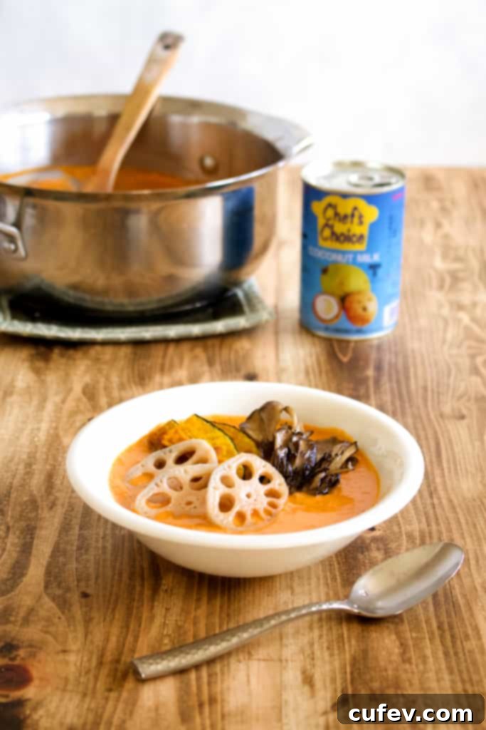 A close-up shot of cooked kabocha squash, lotus root slices, and maitake mushrooms, golden-brown and perfectly tender, ready to be added to the curry.