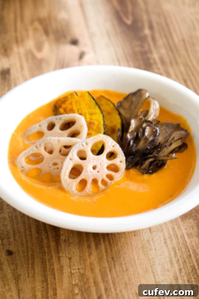 A vibrant bowl of vegan coconut curry, showcasing its creamy texture, colorful vegetables, and inviting steam, embodying comfort food perfection.