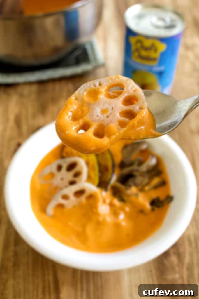 A close-up of a can of Chef's Choice coconut milk, highlighting its quality and role in making the curry super creamy and rich.