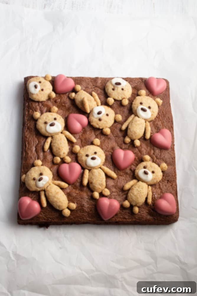 Bear Hug Valentine Brownies 8 If you’re looking for a cute Valentine’s Day treat, look no further! These teddy bear brownies are cakey brownies topped with cookies and ruby chocolate hearts!