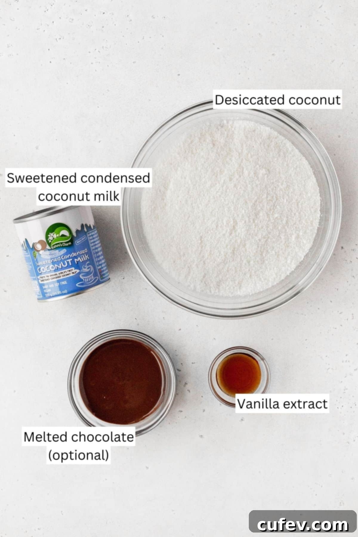 Measured out ingredients for making vegan macaroons in separate bowls, ready for mixing.