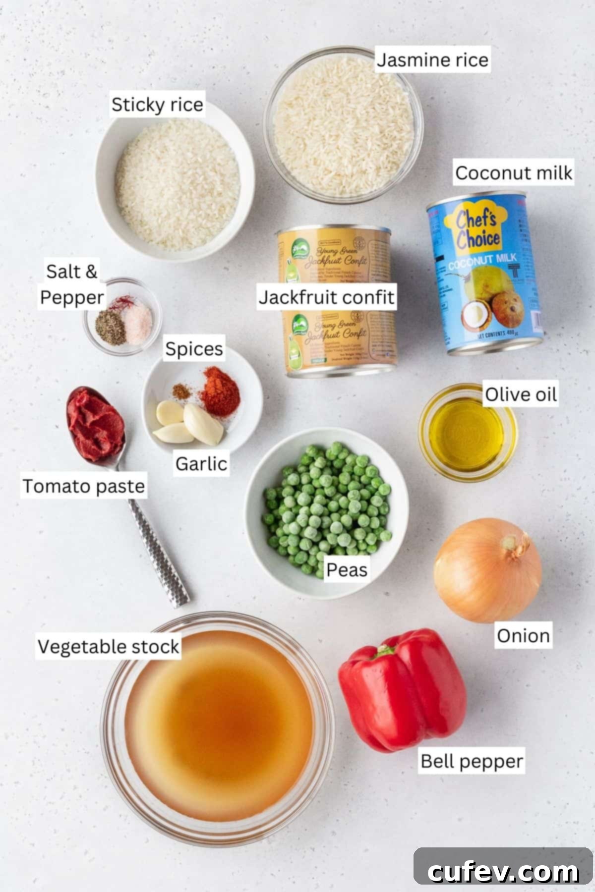 Ingredients for making vegan Arroz Valenciana laid out on a table with text overlay.