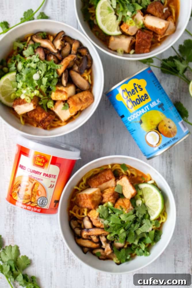 Key ingredients for vegan Thai red curry ramen, showcasing a jar of red curry paste and a can of coconut milk.