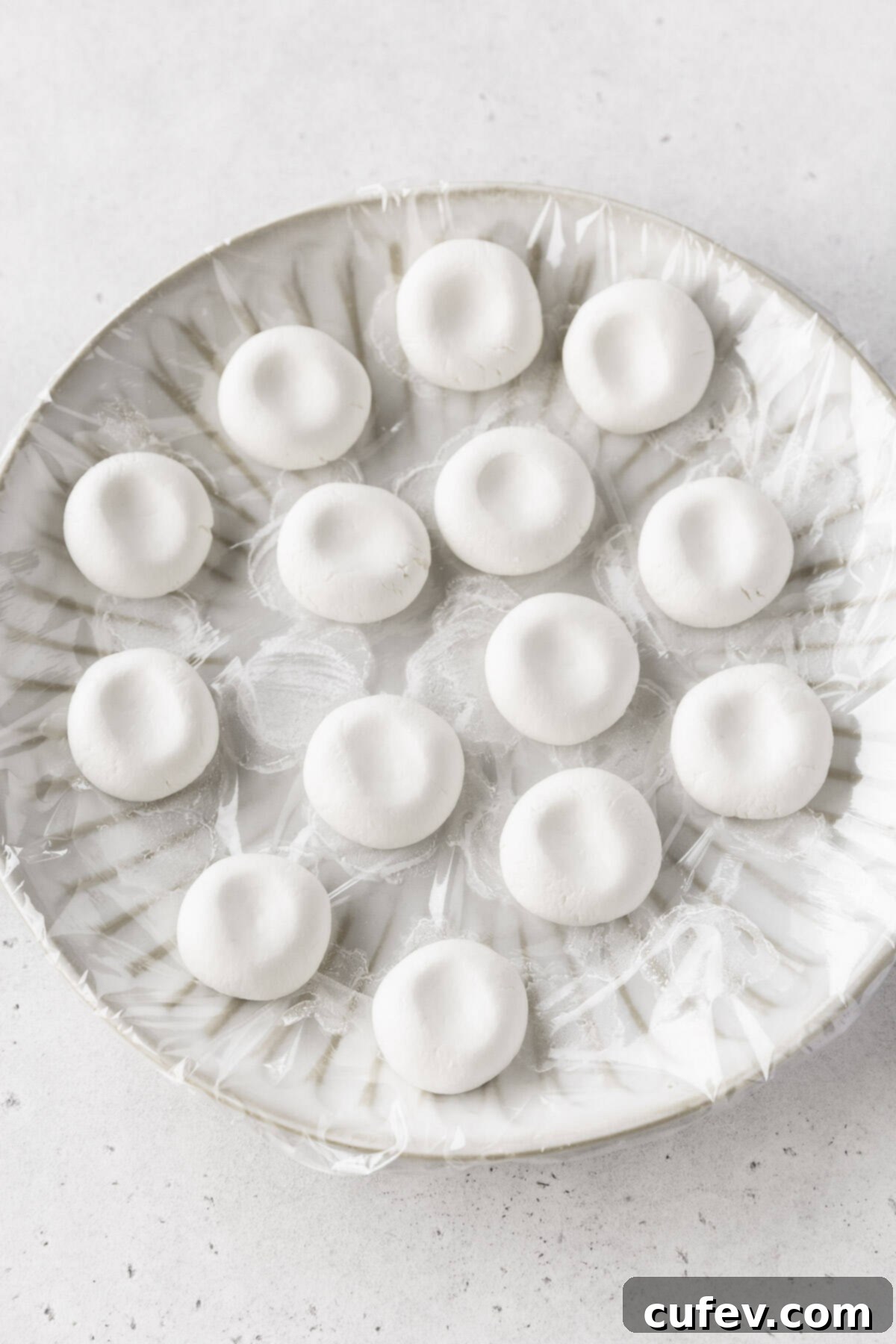 Shiratama dango dough with finger imprints, ready to be boiled.