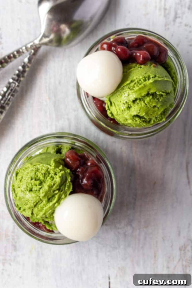 Two jars with matcha ice cream, shiratama, and red bean paste.