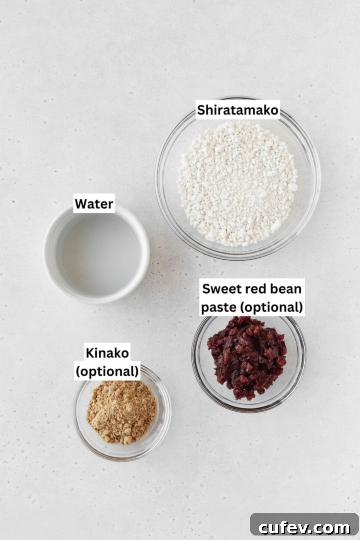 Ingredients to make shiratama measured into small bowls on a white surface.