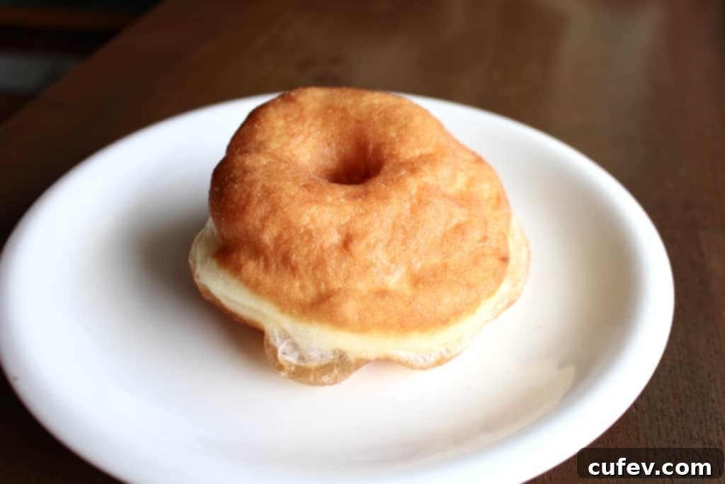 Doughnut scraps collected, reminding bakers not to re-roll them for best results, alongside freshly cut doughnuts.